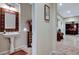 This bathroom offers a pedestal sink and decorative mirror adding a touch of elegance at 8113 Bay Colony St, Las Vegas, NV 89131