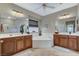 Bathroom with double sinks, a soaking tub, and neutral tones at 8113 Bay Colony St, Las Vegas, NV 89131