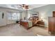 Comfortable bedroom with large window, four-post bed, and ample closet space at 8113 Bay Colony St, Las Vegas, NV 89131
