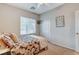 This bedroom features a cozy bed with a floral pattern and a sliding-door closet at 8113 Bay Colony St, Las Vegas, NV 89131
