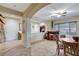 Bright dining area with tile floors, a wooden table, and a bar with stools at 8113 Bay Colony St, Las Vegas, NV 89131