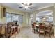 Dining area with tile flooring, a bar, and views to other rooms. Natural light filters in through the blinds at 8113 Bay Colony St, Las Vegas, NV 89131