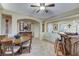 Inviting dining space showcasing the bar, neutral paint, and tile flooring in an open-concept design at 8113 Bay Colony St, Las Vegas, NV 89131