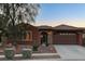 Charming single-story home with a well-maintained front yard and attached two car garage at 8113 Bay Colony St, Las Vegas, NV 89131