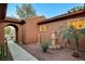 View of the front yard and porch shows the rock ground cover and plants at 8113 Bay Colony St, Las Vegas, NV 89131