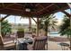 Outdoor gazebo with comfortable seating and view, perfect for relaxation and enjoying the serene surroundings at 8113 Bay Colony St, Las Vegas, NV 89131