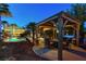 Backyard gazebo with a seating area overlooking the pool and landscaping, creating an entertainment space at 8113 Bay Colony St, Las Vegas, NV 89131