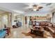 Open concept living room showcases tile floors and seamlessly connects to the kitchen and dining area at 8113 Bay Colony St, Las Vegas, NV 89131