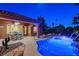 Beautiful backyard pool with a covered patio, an outdoor dining area, and a meticulously maintained pool at 8113 Bay Colony St, Las Vegas, NV 89131