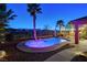 Modern backyard pool with desert landscaping, and elegant lighting, providing relaxation and entertainment at 8113 Bay Colony St, Las Vegas, NV 89131