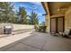 A covered patio with outdoor seating and a grill, perfect for entertaining at 8698 Waterford Bend St, Las Vegas, NV 89123