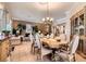 Elegant dining area featuring a formal dining set, stylish decor, and an adjacent living room area at 8698 Waterford Bend St, Las Vegas, NV 89123