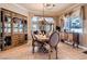 Elegant dining area featuring a formal dining set, stylish decor, and an adjacent living room area at 8698 Waterford Bend St, Las Vegas, NV 89123