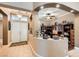 Welcoming home entrance with decorative details, arched openings, and a glimpse into the adjacent office space at 8698 Waterford Bend St, Las Vegas, NV 89123