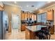 Bright kitchen features a granite island, stainless steel appliances, and ample counter space at 8698 Waterford Bend St, Las Vegas, NV 89123