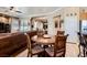 Open-concept living area with a view of the kitchen, dining table, and a comfortable seating area at 8698 Waterford Bend St, Las Vegas, NV 89123