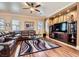 Comfortable living room boasts hardwood floors, a plush leather couch, and stylish decor at 8698 Waterford Bend St, Las Vegas, NV 89123