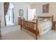 Spacious bedroom features a wooden bed frame with dresser and view to an ensuite bathroom at 928 Collingtree St, Las Vegas, NV 89145