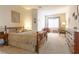 Inviting bedroom with a wooden bed frame, dresser, and natural light at 928 Collingtree St, Las Vegas, NV 89145