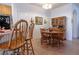 Charming dining area with an adjacent breakfast bar and wood table and chairs at 928 Collingtree St, Las Vegas, NV 89145