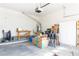 Spacious garage filled with belongings including boxes, tables, household items, and storage at 928 Collingtree St, Las Vegas, NV 89145