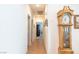 View of the tiled hallway featuring an antique wooden clock and wall decor at 928 Collingtree St, Las Vegas, NV 89145