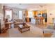 Inviting living room featuring an open floor plan connected to the kitchen with barstool seating at 928 Collingtree St, Las Vegas, NV 89145