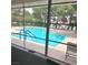 Community pool view with plenty of seating and lush greenery at 928 Collingtree St, Las Vegas, NV 89145