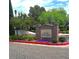 Fairway Pointe entrance sign with landscaped flowerbeds and trees at 928 Collingtree St, Las Vegas, NV 89145