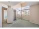 Bedroom features large window with natural light and open closet at 1009 Nawkee Dr, North Las Vegas, NV 89031