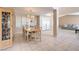 Elegant dining room with an hutch, chandelier, and an open flow to the living spaces at 1009 Nawkee Dr, North Las Vegas, NV 89031