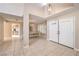 Welcoming foyer with tile floors, a decorative chandelier, and views of the dining room at 1009 Nawkee Dr, North Las Vegas, NV 89031