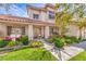 Inviting front porch with swing and well-maintained landscaping enhances the curb appeal at 1009 Nawkee Dr, North Las Vegas, NV 89031