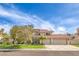 Charming home with a well-maintained lawn and a three-car garage at 1009 Nawkee Dr, North Las Vegas, NV 89031