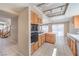 Modern kitchen featuring wooden cabinets, and an open layout at 1009 Nawkee Dr, North Las Vegas, NV 89031