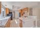 Functional kitchen with wood cabinets, tile countertops, and modern lighting at 1009 Nawkee Dr, North Las Vegas, NV 89031
