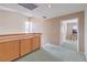 Upstairs landing area with wooden cabinets, leading to another room at 1009 Nawkee Dr, North Las Vegas, NV 89031