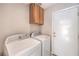 Convenient laundry room with a washing machine, dryer, and overhead cabinet at 1009 Nawkee Dr, North Las Vegas, NV 89031