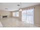 Inviting living room featuring a fireplace, tile flooring, and natural light at 1009 Nawkee Dr, North Las Vegas, NV 89031