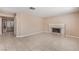 Spacious living room with neutral walls, tile flooring, and a cozy fireplace at 1009 Nawkee Dr, North Las Vegas, NV 89031