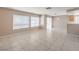 Bright living room with tile flooring and a view to backyard at 1009 Nawkee Dr, North Las Vegas, NV 89031