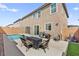 A beautiful backyard featuring a sparkling pool and outdoor seating area with a BBQ grill at 10101 Heron Lake Ave, Las Vegas, NV 89178