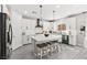 Modern kitchen featuring white cabinets, a center island with seating, and stainless steel appliances at 10101 Heron Lake Ave, Las Vegas, NV 89178