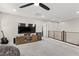 Living Room featuring a flat screen tv, a black ceiling fan, and a gray couch at 10101 Heron Lake Ave, Las Vegas, NV 89178