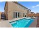 Private backyard with a sparkling pool, patio area for seating, and well-maintained landscaping for outdoor enjoyment at 10101 Heron Lake Ave, Las Vegas, NV 89178