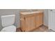 Bathroom featuring tile flooring and wood-look vanity at 10550 W Alexander Rd # 2064, Las Vegas, NV 89129