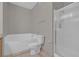 Neutral bathroom with a tub, toilet, and a glass enclosed shower at 10550 W Alexander Rd # 2064, Las Vegas, NV 89129