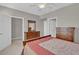 Clean bedroom featuring a ceiling fan, closet, and wooden furniture at 10550 W Alexander Rd # 2064, Las Vegas, NV 89129