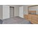 Bright bedroom featuring a closet and dresser with mirror at 10550 W Alexander Rd # 2064, Las Vegas, NV 89129