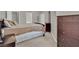 Bedroom featuring neutral walls, carpet, and dark wood furniture at 10550 W Alexander Rd # 2064, Las Vegas, NV 89129